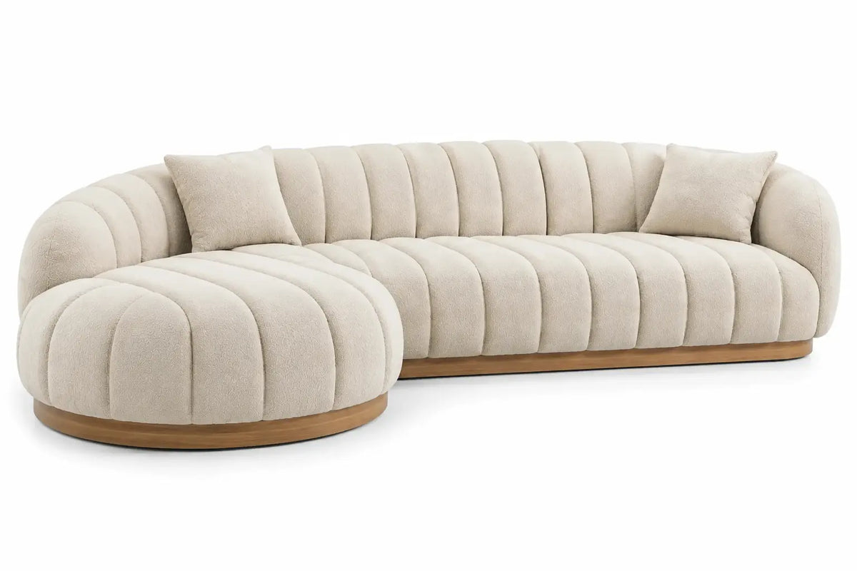 Divano angolare, penisola arrotondata e rivestimento a coste, beige